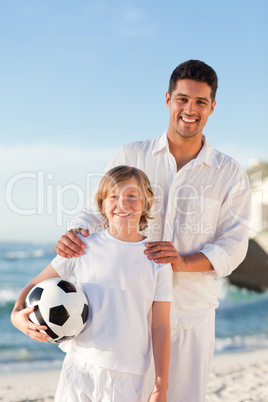 Father and  his son on the beach