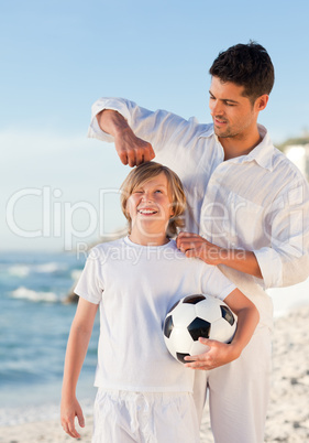Father and  his son on the beach