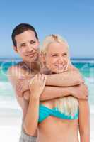 Enamored couple on the beach