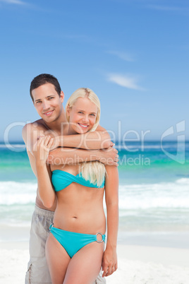 Enamored couple on the beach