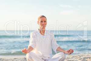 Peaceful woman practicing yoga
