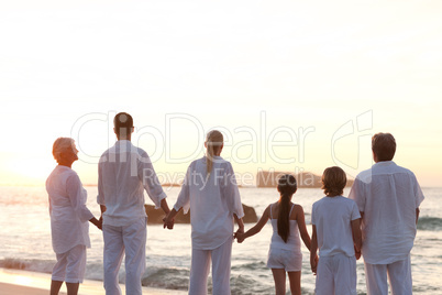 Family at the beach during the sunset