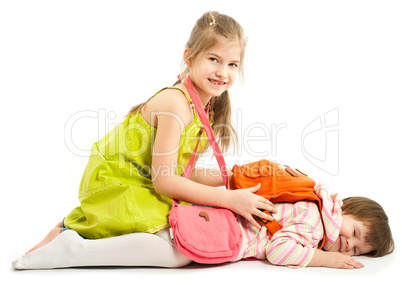 Two kids playing on the floor