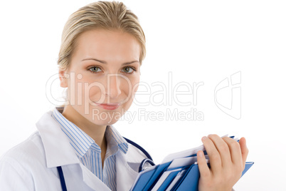 Young female doctor with stethoscope on white