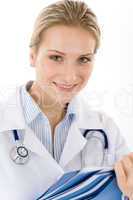 Young female doctor with stethoscope on white