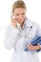 Young female doctor on the phone