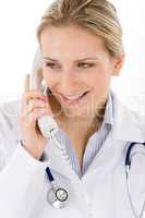 Smiling female doctor on the phone