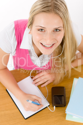 Cheerful student woman write homework