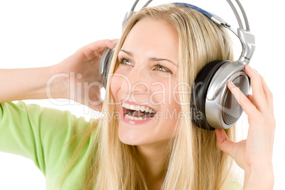 Cheerful woman with headphones listen to music