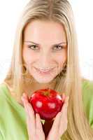 Healthy lifestyle - woman holding red apple
