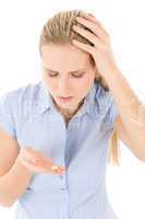 Young woman with headache, migraine take pill