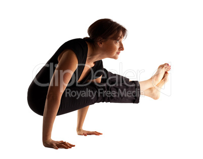 Mature woman stand on hands  in yoga pose