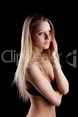 Young blond girl in lingerie - sadness emotion