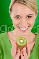Healthy lifestyle - happy woman holding kiwi