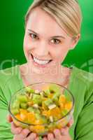 Healthy lifestyle - woman holding fruit salad bowl