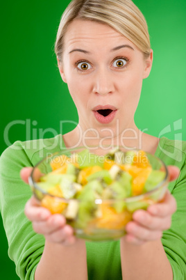 Healthy lifestyle - woman holding fruit salad bowl