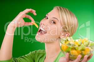 Healthy lifestyle - woman eat fruit salad