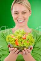 Healthy lifestyle - woman holding vegetable salad