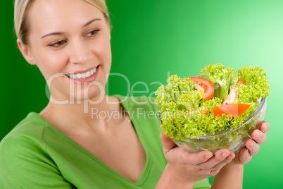 Healthy lifestyle - woman holding vegetable salad