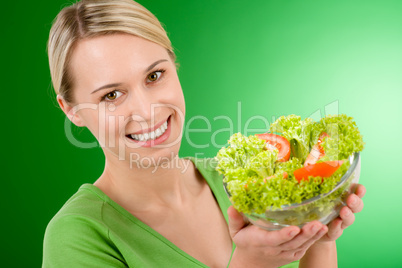 Healthy lifestyle - woman holding vegetable salad