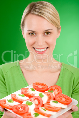 Healthy lifestyle - woman with caprese salad