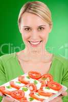 Healthy lifestyle - woman with caprese salad