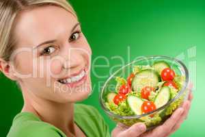 Healthy lifestyle - woman holding vegetable salad