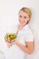 Healthy lifestyle - smiling woman with vegetable salad