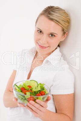 Healthy lifestyle - smiling woman with vegetable salad