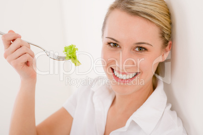 Healthy lifestyle - cheerful woman with lettuce