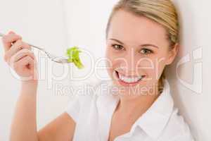 Healthy lifestyle - cheerful woman with lettuce