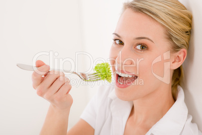 Healthy lifestyle - young woman with lettuce