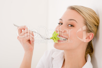 Healthy lifestyle - young woman with lettuce