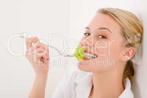 Healthy lifestyle - young woman with lettuce