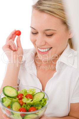 Healthy lifestyle - smiling woman with vegetable salad