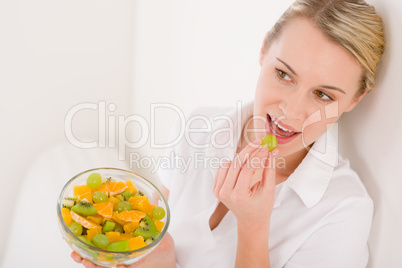 Healthy lifestyle - woman holding bowl with fruit salad