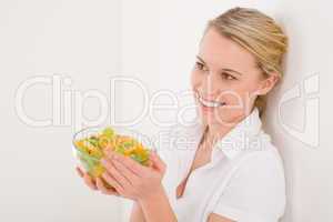 Healthy lifestyle - woman holding bowl with fruit salad