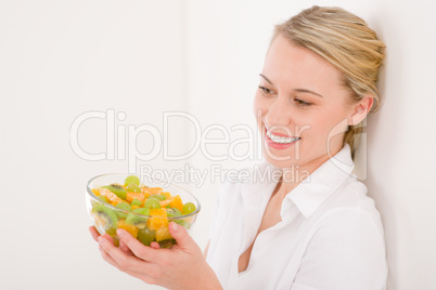 Healthy lifestyle - woman holding bowl with fruit salad