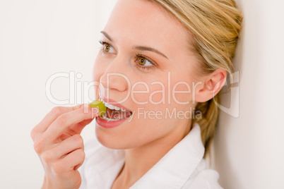 Healthy lifestyle - portrait of woman bite grape