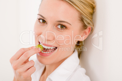 Healthy lifestyle - portrait of woman bite grape