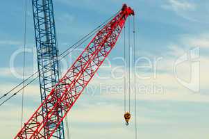 two construction cranes over blue sky