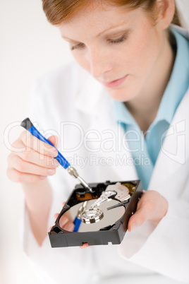 Female computer engineer - woman repair hard disc