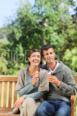 Young couple eating an ice cream