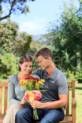 Man offering flowers to his girlfriend