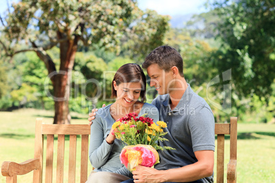 Man offering flowers to his girlfriend