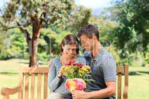 Man offering flowers to his girlfriend