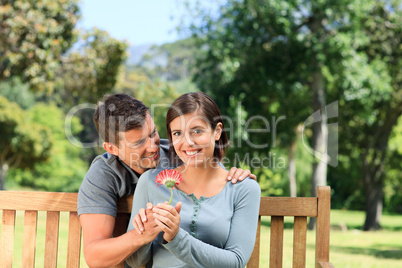 Man and his wife with a flower