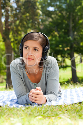 Woman listening to some music in the park