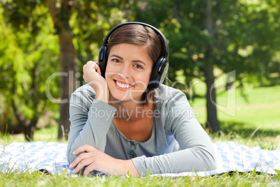 Woman listening to some music in the park