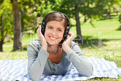 Woman listening to some music in the park
